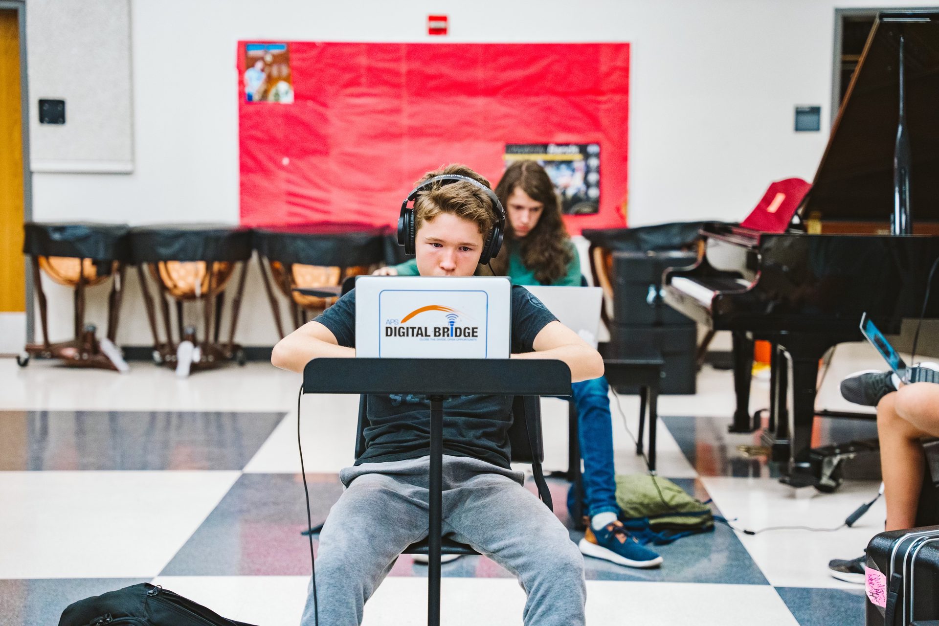 A student working on music in the band room