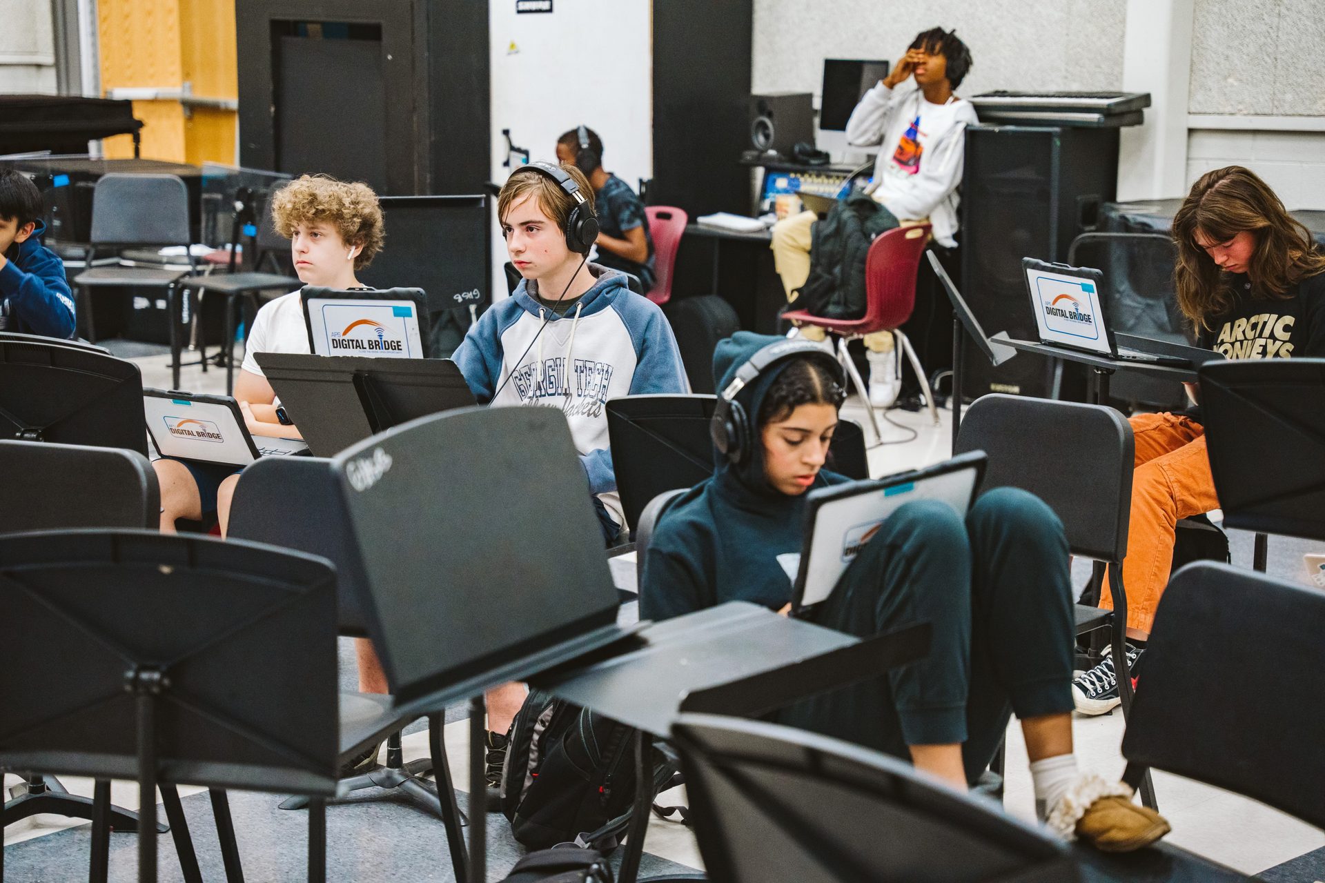 Students producing in the band room